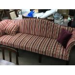 A George 111 style three seater sofa with scrolled