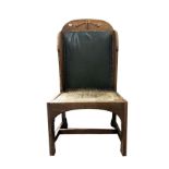 An oak arts and crafts chair with inlaid back leat