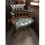 A modern green leather captains chair.