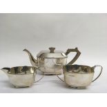 A three piece silver tea service comprising matchi