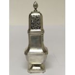 A silver sugar caster of square shape the top with