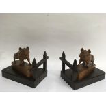 A pair of Black Forest bookends carved as wild boars.Approx 20x24cm