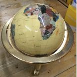 A large gemstone set globe.Stand approx 32cm high