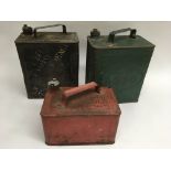 Three old petrol cans