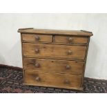 A table top pine chest with with two short drawers