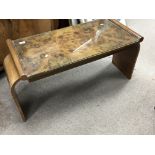 An Art Deco burr walnut coffee table with a rectan