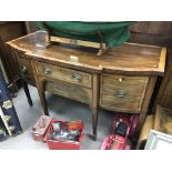 An inlaid mahogany sideboard fitted with central d