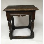 An 18th Century oak joint stool.