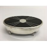 An oval shaped, silver and tortoiseshell top box,