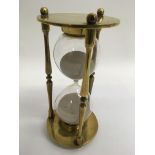 An old brass sand timer.Approx 24cm