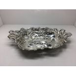 A silver embossed dish marked for H/M Birmingham