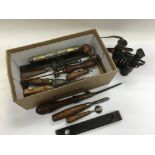 A box of odds including a pair of binoculars, vintage tools etc.