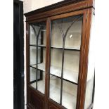 A Edwardian mahogany display cabinet with a pair o