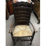 A rush seated ladder back chair