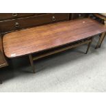 A Retro coffee table with rectangular top above tu