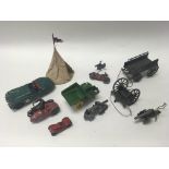 A collection of tin plate and metal vehicles including a Condon tipper truck, a Scalex Jaguar, a WW1