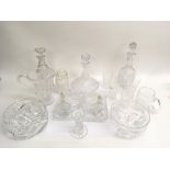 A collection of cut and crystal glassware including decanters