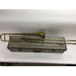 A cased trombone.