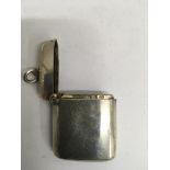 A small silver Matchbox striker