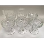 A set of six cut glass grapefruit dishes.