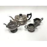 A silver plated teapot and a three piece silver pl