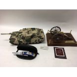 A Franklin Mint M1AI Abrams Tank, A Civil War 1857 field gun, a collectors knife commemorating