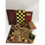 Two boxed sets of turned wood chess pieces plus odd pieces and boards