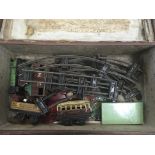 An unboxed Hornby O gauge locomotive one carriage and 2 goods wagons together with some Meccano
