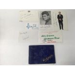 An autograph book containing various autographs including Apollo 15 astronaut James B Irwin,