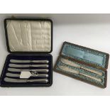 A cased set of silver butter knives, one missing,