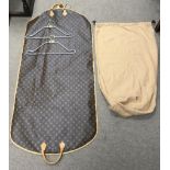A Louis Vuitton designer suit bag with dust bag and two conforming hangers.Approx 24cm long