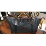 A smaller Mulberry designer overnight bag of similar design, with contrasting brown leather