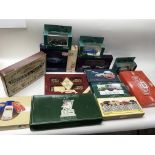 A collection of boxed model vehicle sets including Lledo gold plated British Motoring classics of