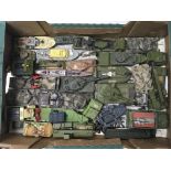 A box of unboxed military vehicles including Dinky tanks.