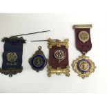 Four silver gilt and enamel Buffalo medals