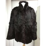A red brown fur coat, approx 10/12