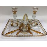 A clear and amber coloured glass dressing table set (4).