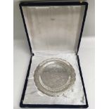 An Egyptian engraved silver dish in fitted box.App