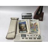 A vintage Stylophone, a Casio electronic instrument and a Metronome.