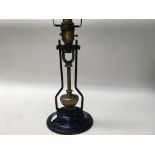 A vintage ships table or wall lamp with heavy brass gimble.