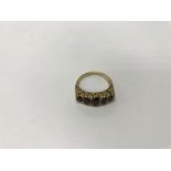 An 18ct gold garnet ring. Weight approx 6.6g, size