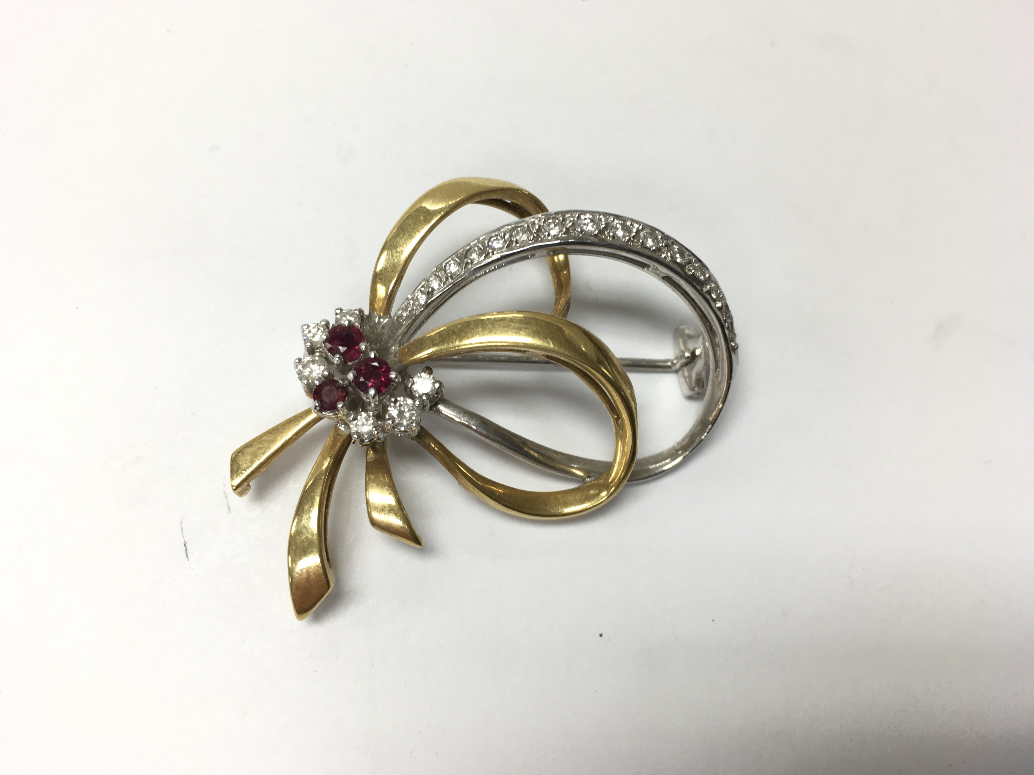 Two tone 18ct gold brooch with rubies and diamonds