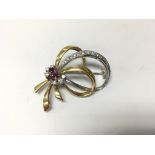 Two tone 18ct gold brooch with rubies and diamonds