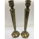 A pair of Chinese brass candlesticks, approx 46.5cm.