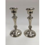 A pair of silver candle sticks, hallmarked Birming