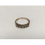 A gold five stone diamond ring, approx 1.5g and ap