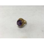 A 9ct gold amethyst ring. Weight approx 10.1g, siz