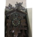 A carved cuckoo clock for repair