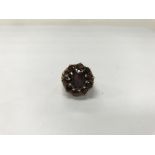 A 9ct gold garnet set ring. Weight approx 8.2g, si