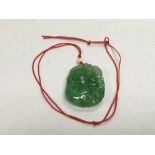 A carved jade pendant.